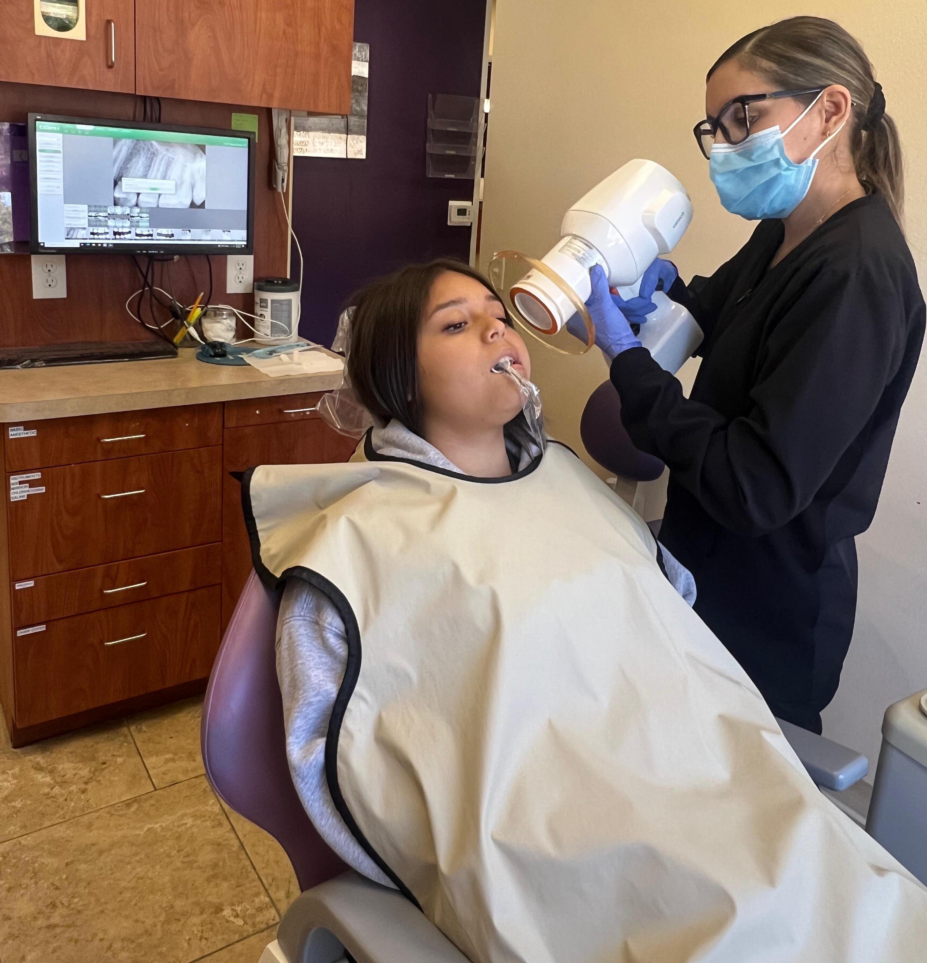 Patient receiving treatment with state-of-the-art dental equipment